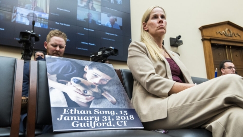 Kristin Song, sits with a picture of her son Ethan, who died at age 15 in a gun accident, during the House Judiciary Committee markup of the Protecting Our Kids Act, in 2022. The bill passed in the House.