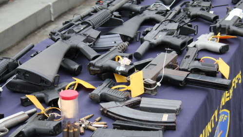 Stock image of guns on a table