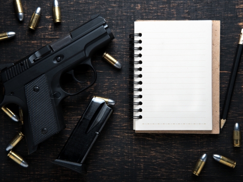 Gun Notepad Stock Image